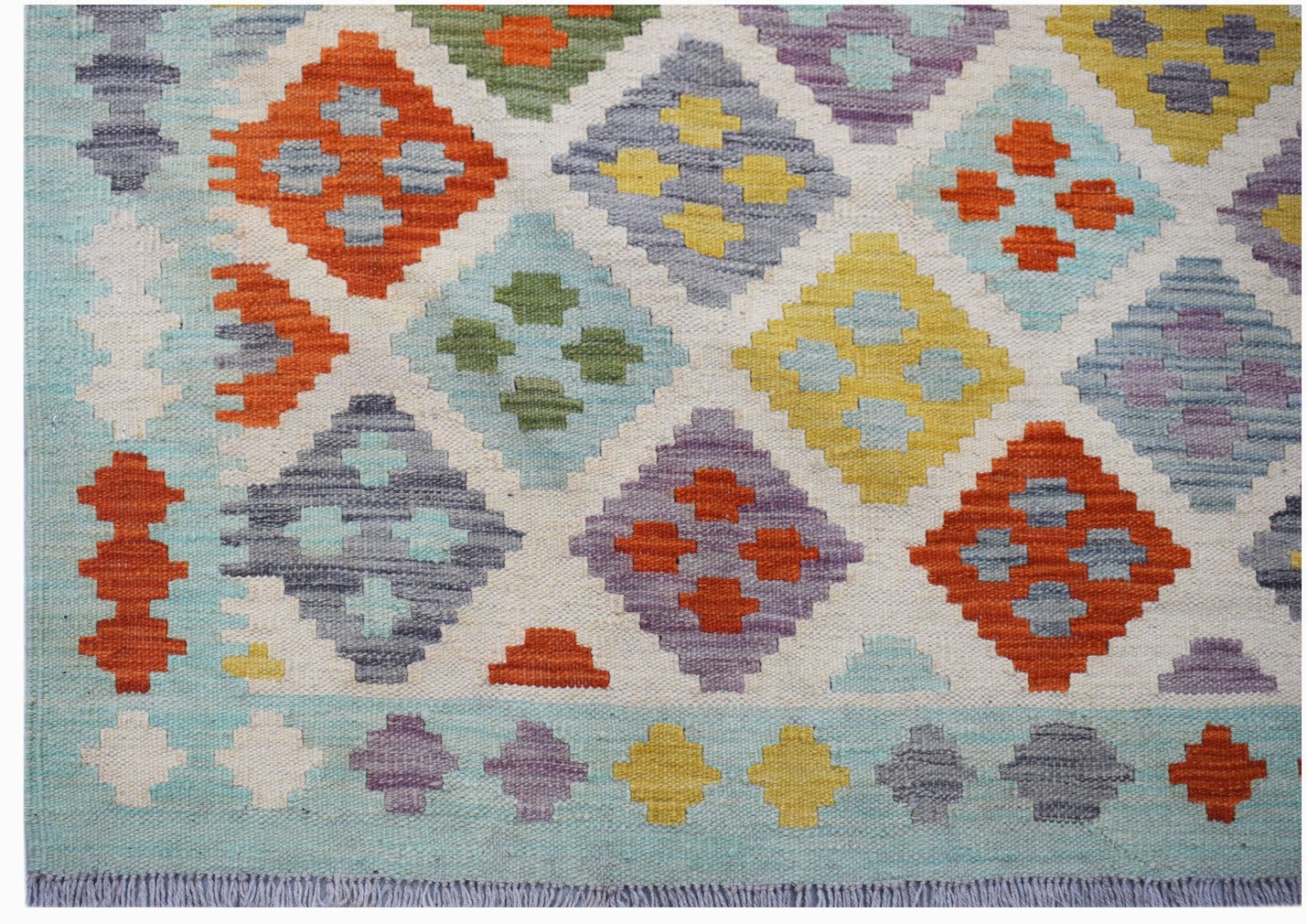 Handmade Afghan Maimana kilim rug featuring a colorful geometric diamond pattern on a wool base.