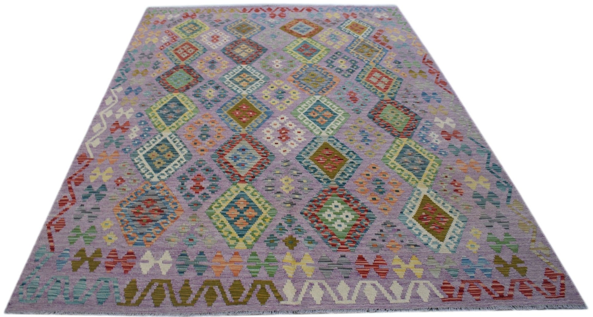 Handwoven Afghan Maimana kilim rug featuring a lavender field with colorful geometric diamond motifs.