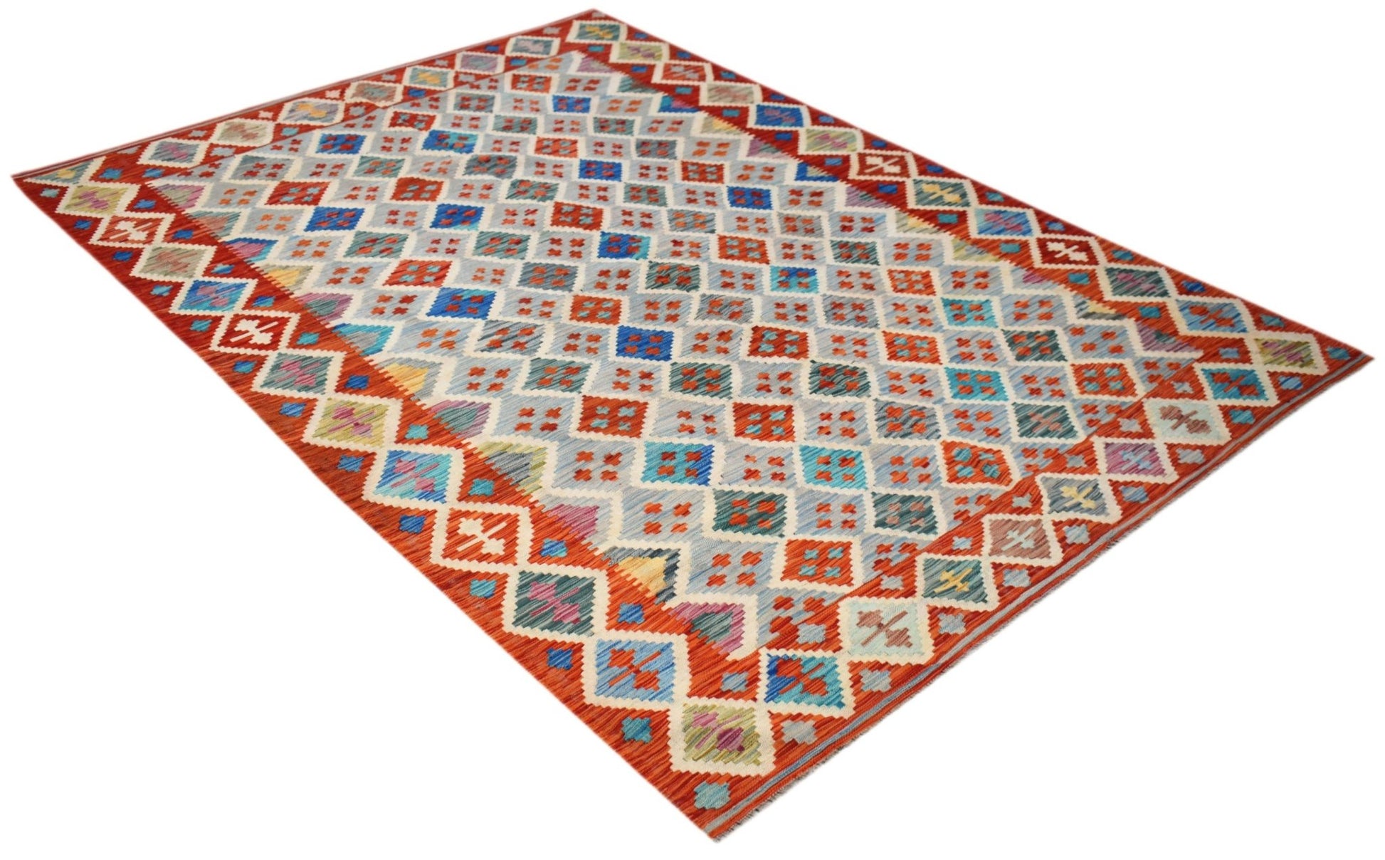 Handwoven Afghan Maimana kilim rug featuring a geometric diamond pattern in red and blue tones.