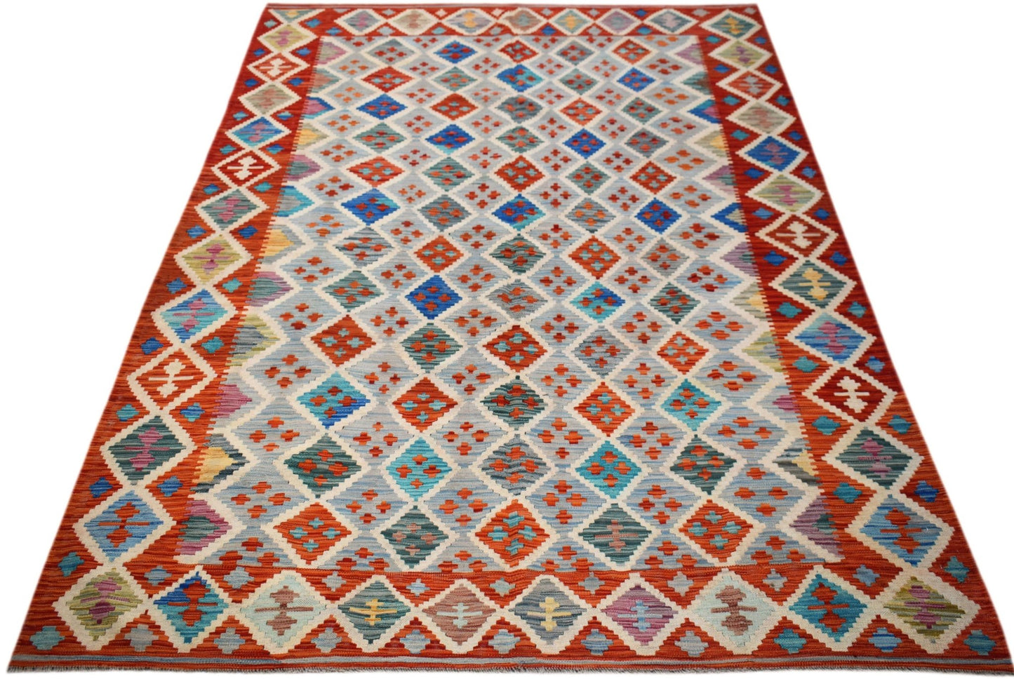 Handwoven Afghan Maimana kilim rug featuring a geometric diamond pattern in vibrant colors.