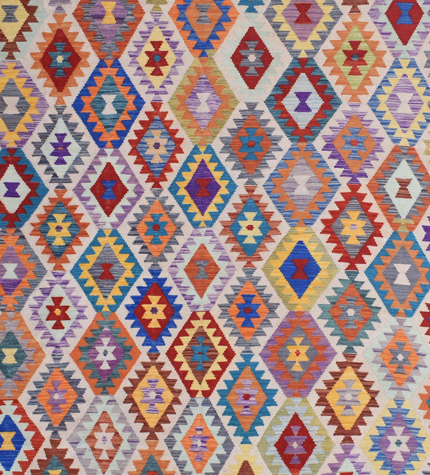Handmade Afghan Maimana kilim rug featuring a vibrant, multicolored geometric diamond pattern.