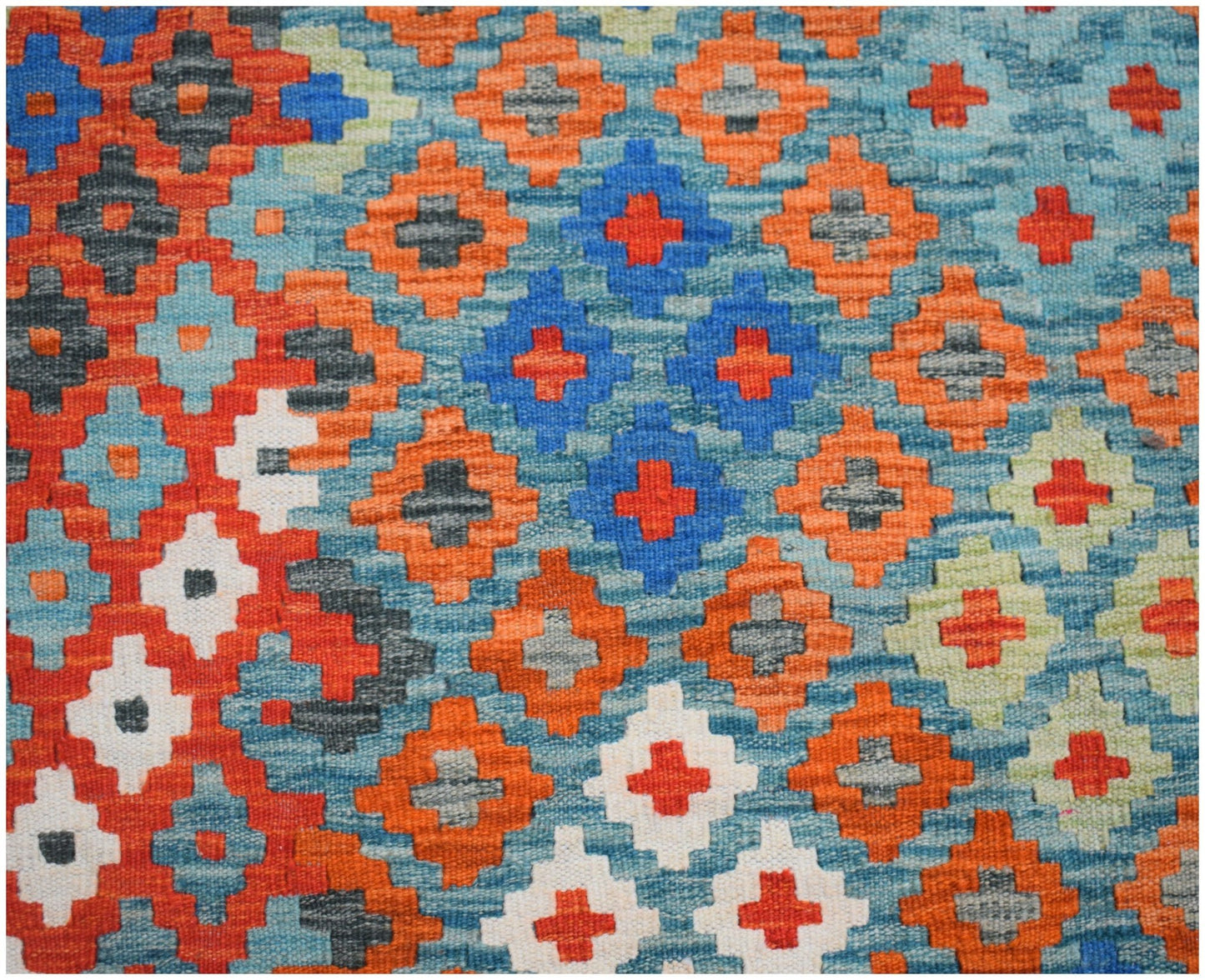 Handwoven Afghan Maimana kilim featuring a vibrant geometric pattern in orange, blue, and white.