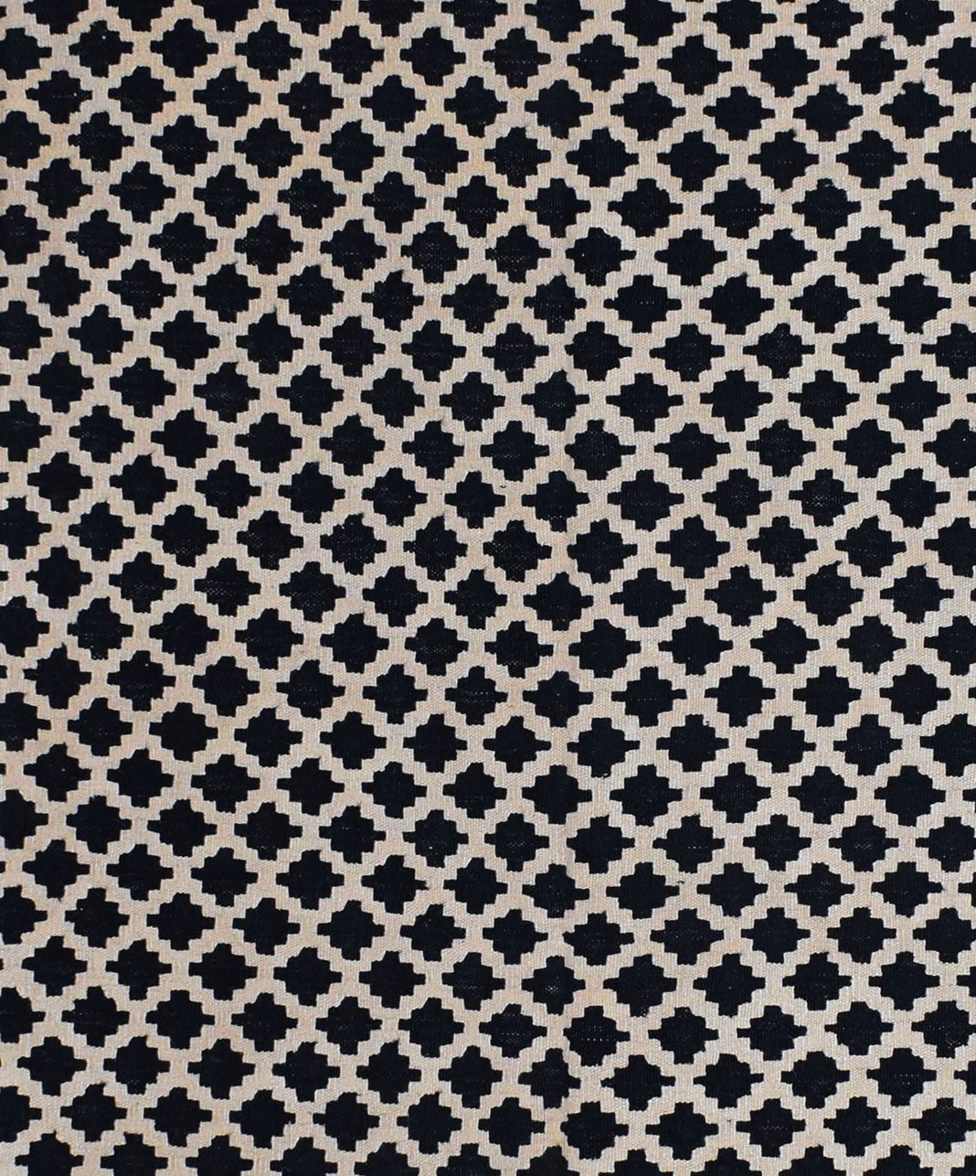 Handmade Afghan Maimana kilim rug featuring a repeating black and cream geometric pattern.