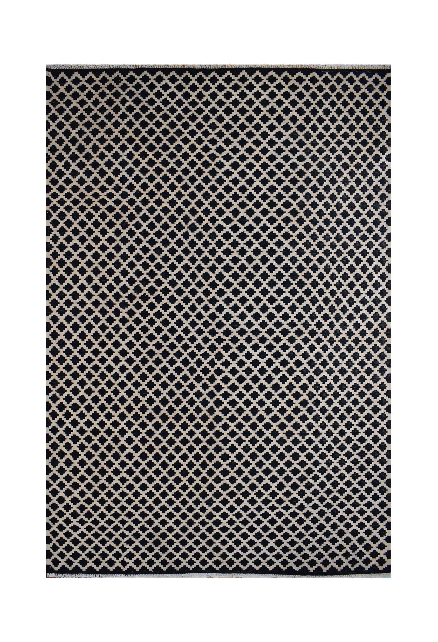 Handmade Afghan Maimana kilim rug featuring a repeating black and beige geometric pattern.