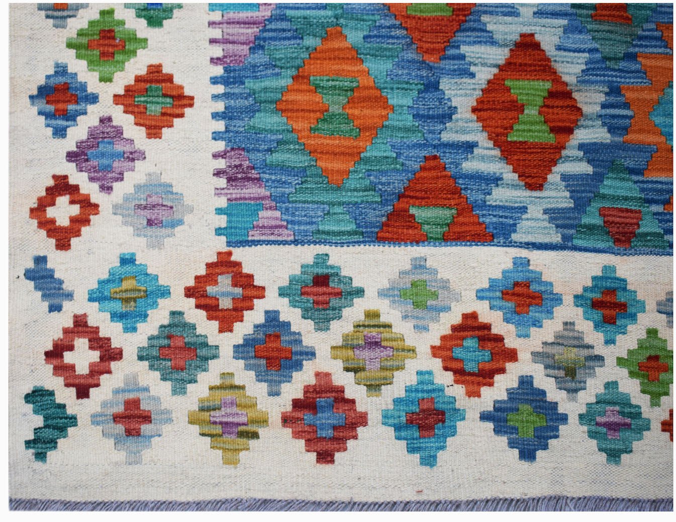 Afghan Maimana Kilim with geometric diamond patterns in red, blue, green, and purple.