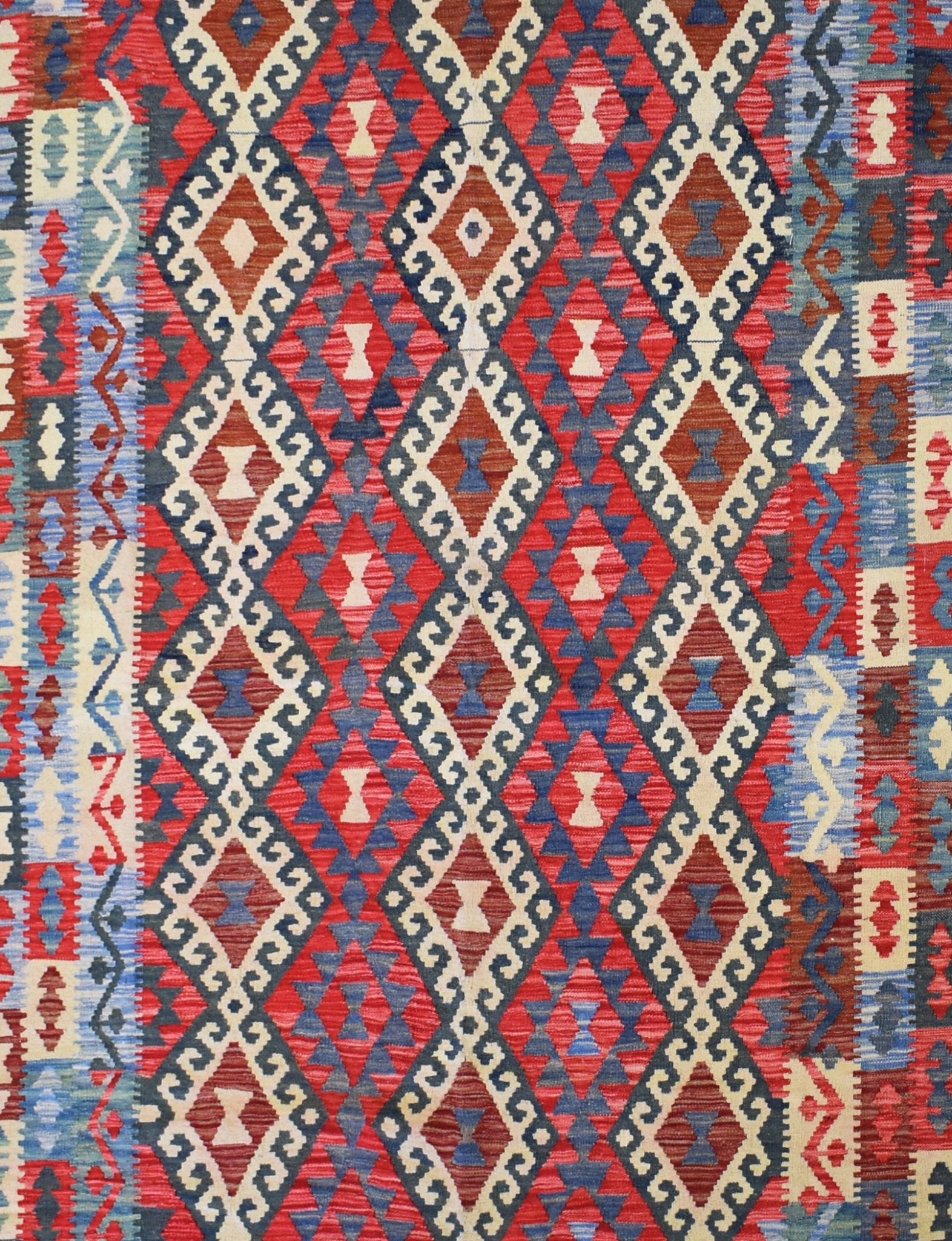 Handmade Afghan Maimana kilim rug featuring a geometric diamond pattern in red, blue, and cream.