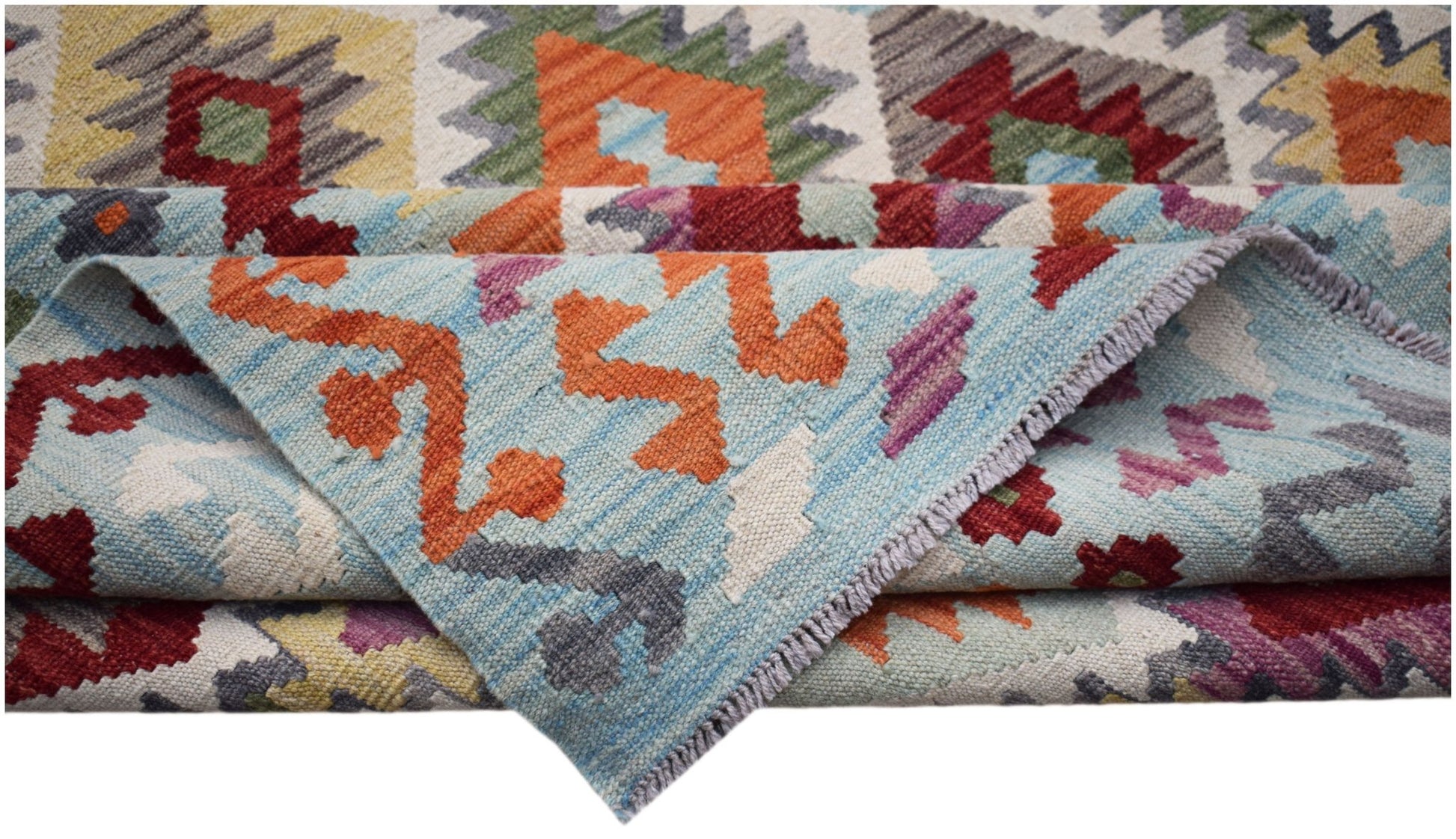 Handwoven Afghan Maimana kilim featuring a vibrant geometric pattern in wool.