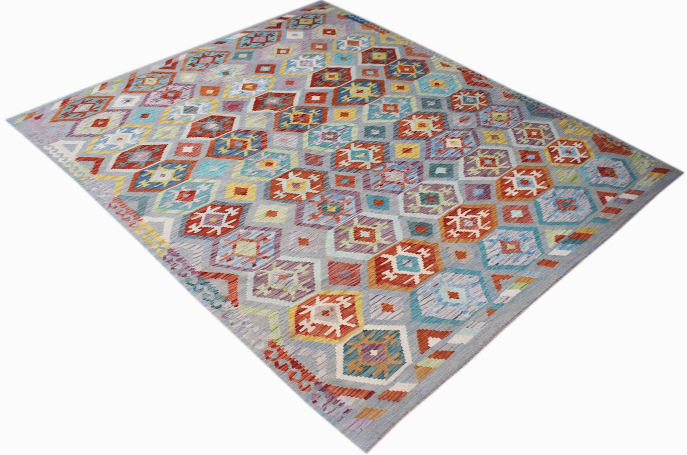 Handwoven Afghan Maimana kilim rug featuring a colorful geometric diamond pattern.