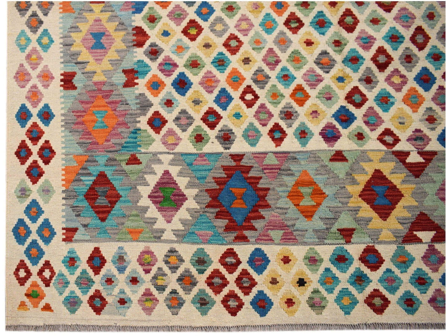 Handwoven Afghan Maimana kilim rug featuring a colorful geometric diamond pattern in wool.
