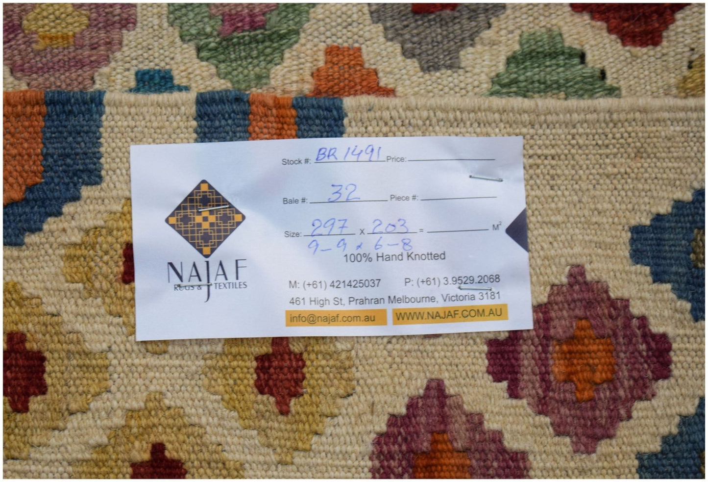 An Afghan Maimana Kilim rug featuring a colorful geometric diamond pattern in a flatweave texture.