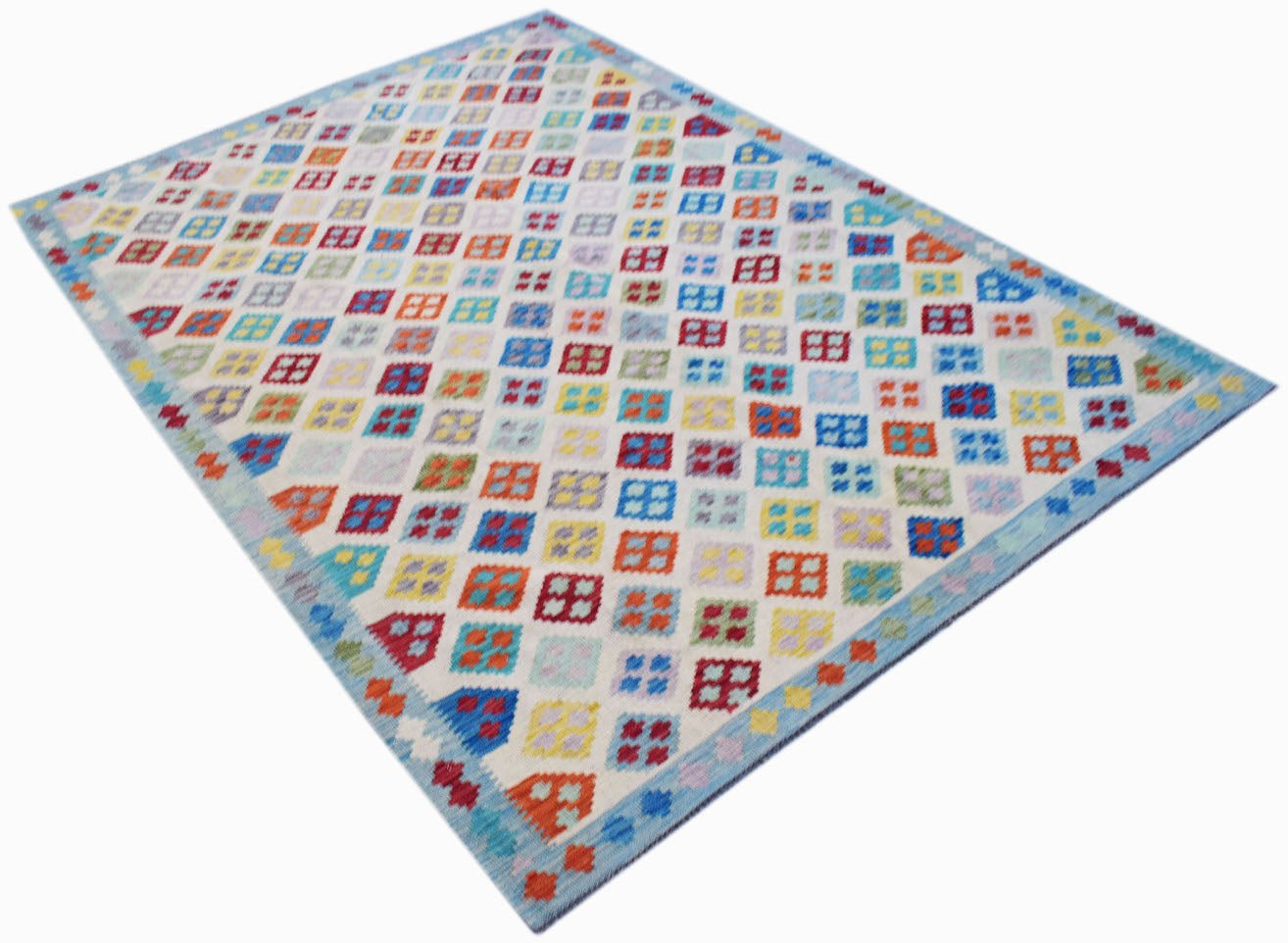 Handwoven Afghan Maimana kilim rug featuring a colorful geometric diamond pattern on a white base.