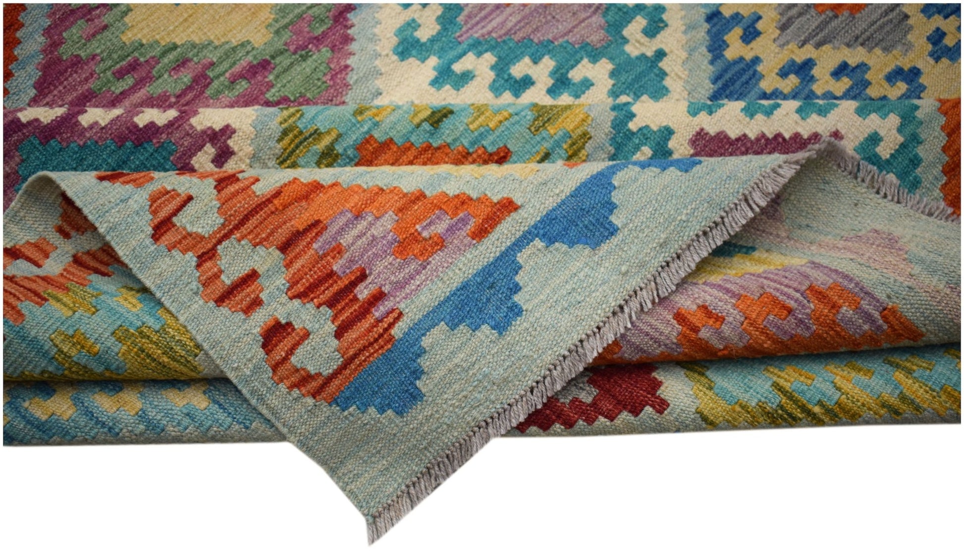 Handwoven Afghan Maimana kilim rug featuring a colorful geometric pattern and flatweave texture.
