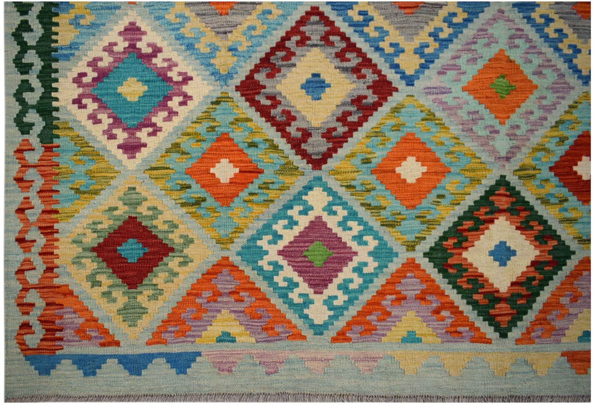 Handwoven Afghan Maimana kilim rug featuring a vibrant geometric diamond pattern in wool.