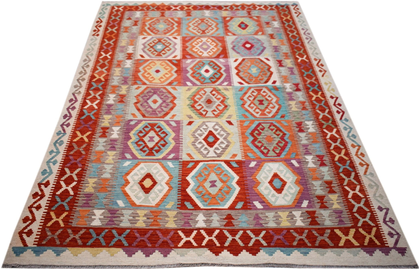 Handwoven Afghan Maimana kilim rug featuring a colorful geometric pattern on a flat wool weave.