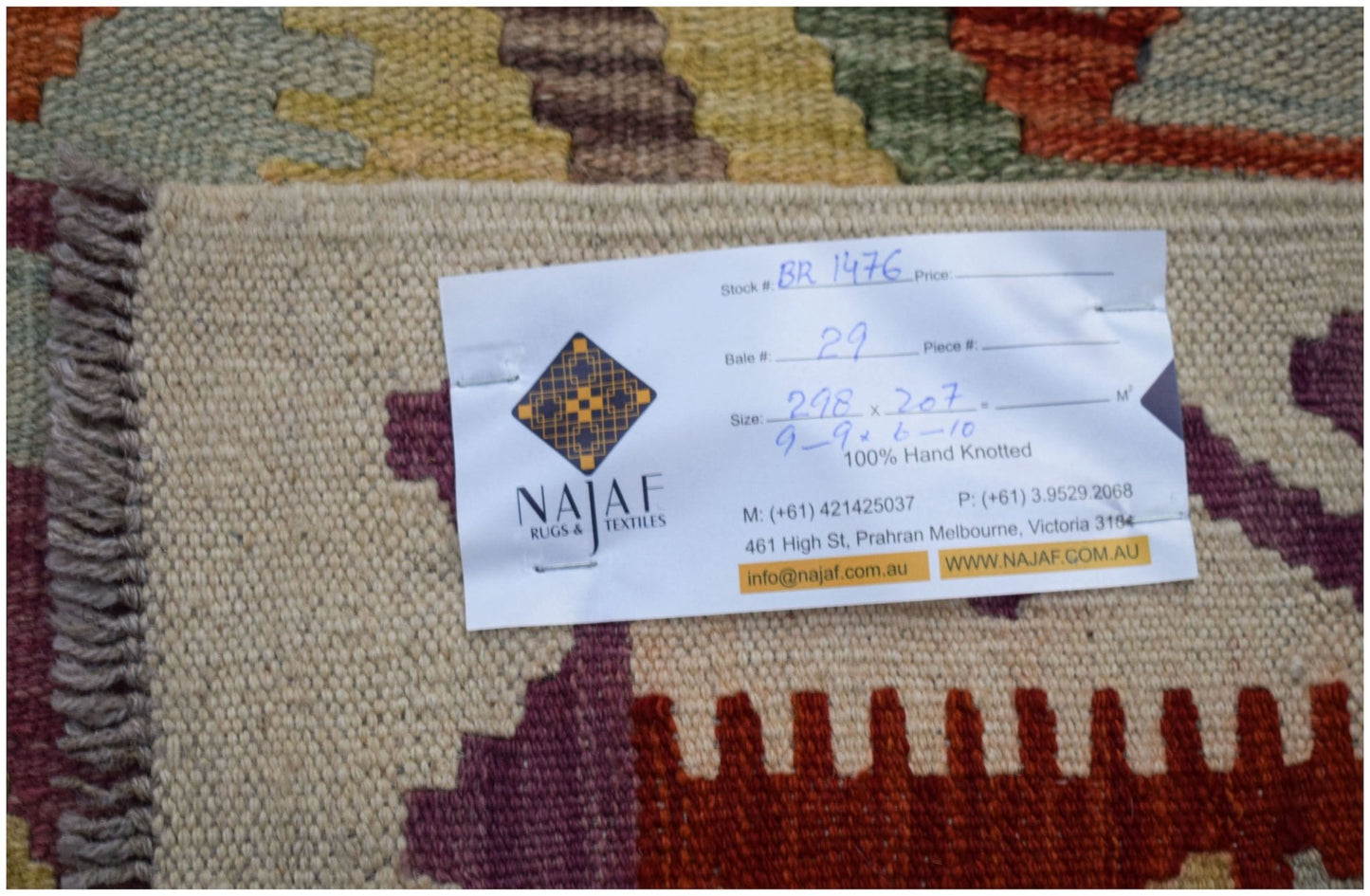 A flatweave Afghan Maimana Kilim featuring a colorful geometric pattern and a fringed edge.