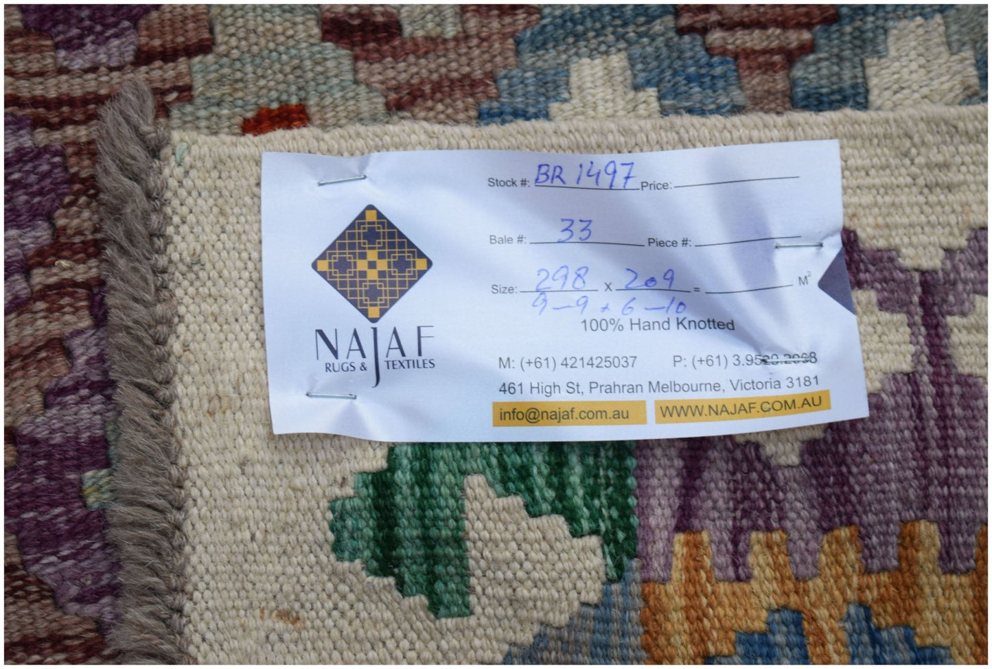 A handmade Afghan Maimana kilim featuring a colorful geometric pattern and flatweave texture.