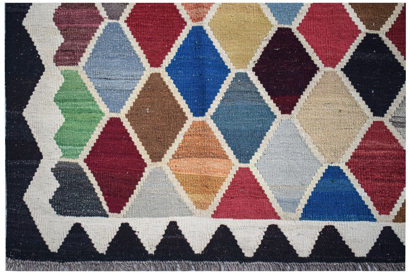 Handwoven Afghan Maimana kilim featuring a colorful diamond pattern and a flat-weave wool texture.