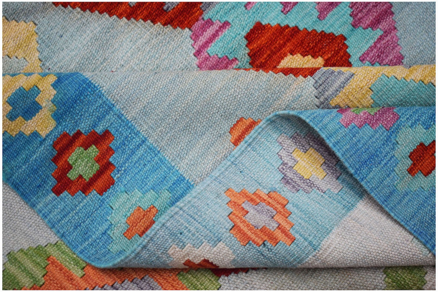 Afghan Maimana Kilim with geometric patterns in blue, red, and yellow.