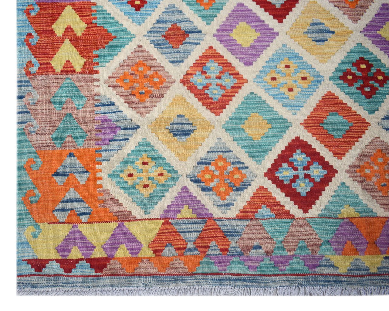 Handwoven Afghan Maimana kilim rug featuring a vibrant geometric diamond pattern in wool.