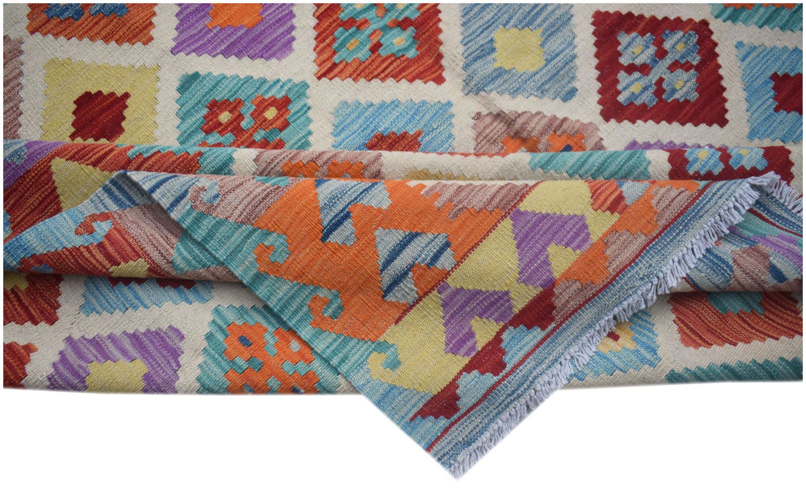 Handwoven Afghan Maimana kilim featuring a colorful geometric pattern and a flat-weave texture.