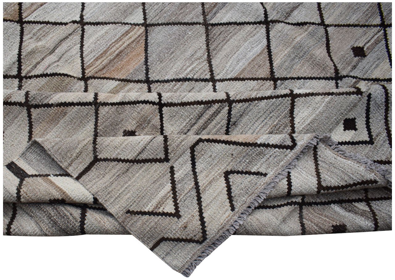 Handwoven Afghan Maimana kilim rug featuring a neutral geometric grid pattern in wool.