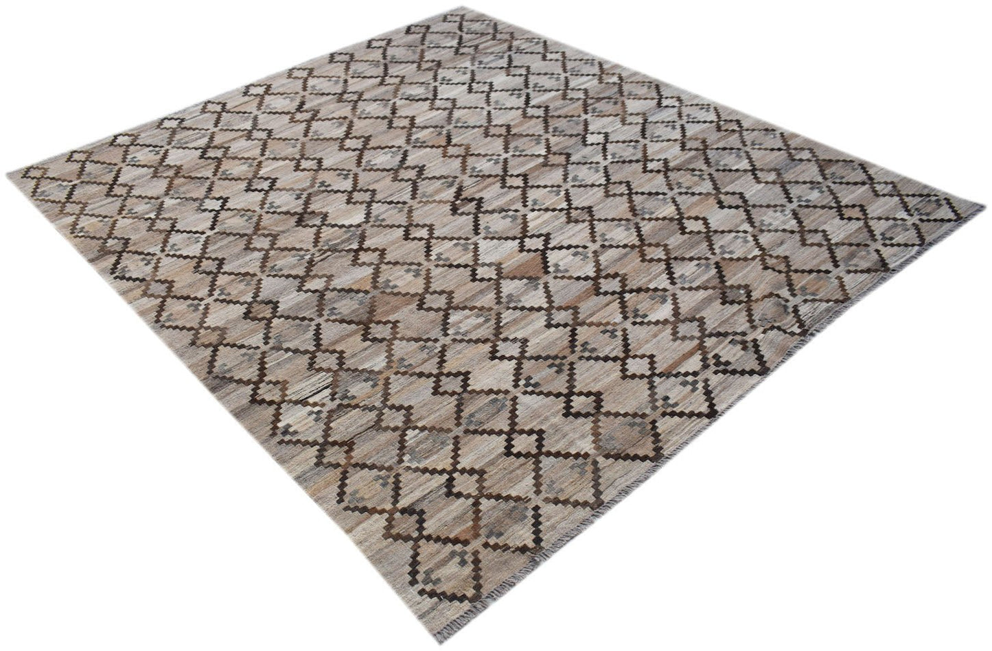 Handwoven Afghan Maimana kilim rug featuring a repeating geometric diamond pattern in neutral tones.