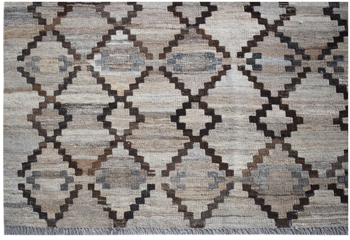 Handwoven Afghan Maimana kilim featuring a geometric diamond pattern in neutral earth tones.
