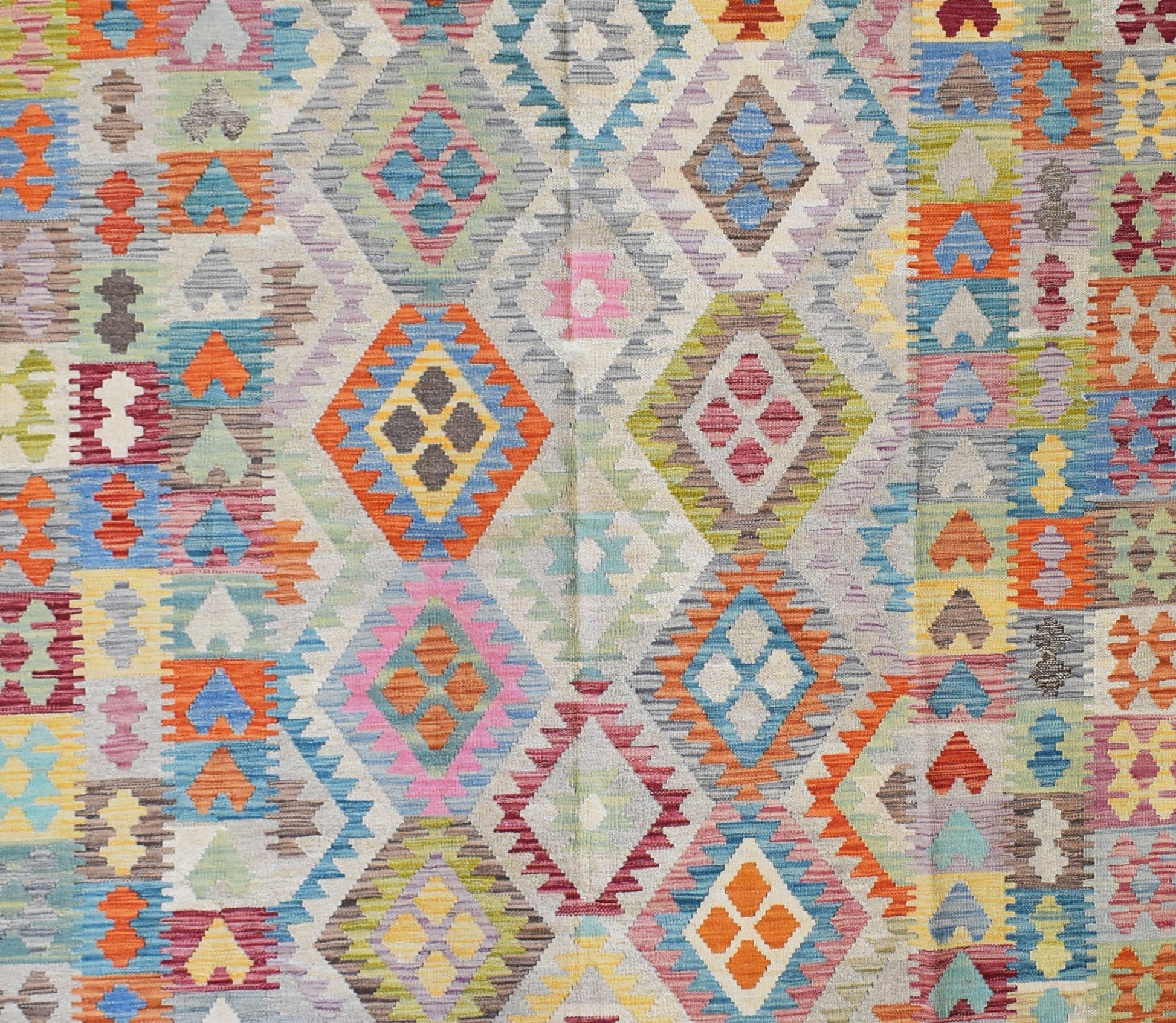 Handmade Afghan Maimana kilim rug featuring a vibrant geometric diamond pattern in wool.
