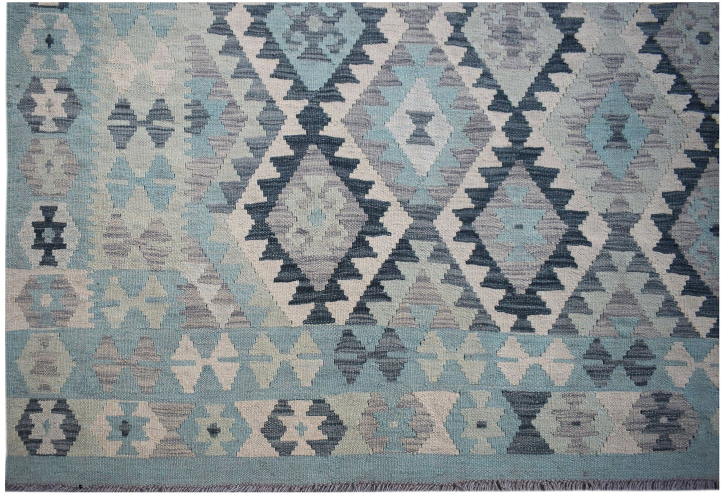 Handwoven Afghan Maimana kilim rug featuring a geometric diamond pattern in shades of blue and grey.