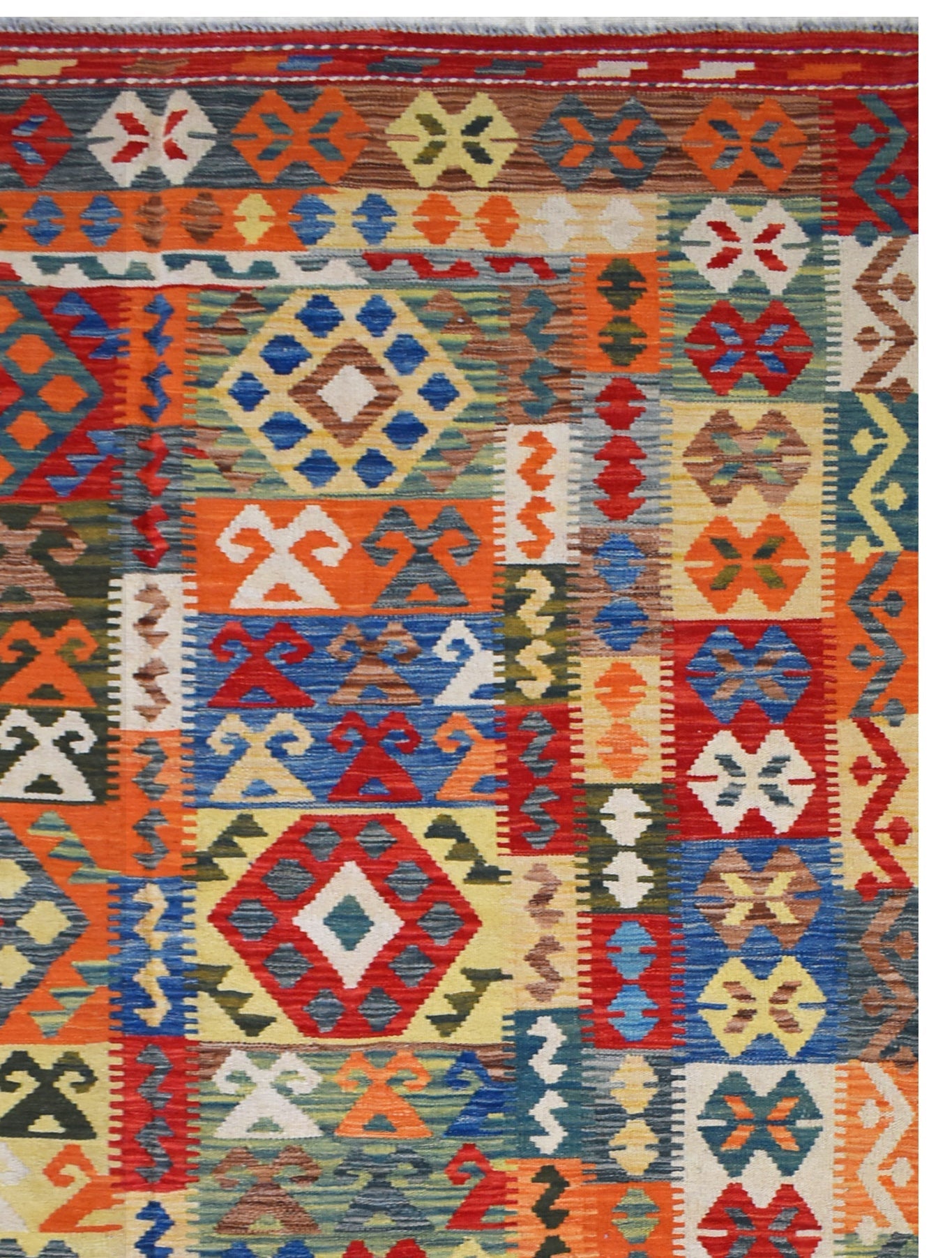 Handmade Afghan Maimana kilim rug featuring a vibrant, multi-colored geometric pattern.