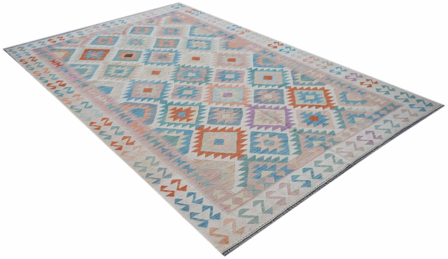 Handwoven Afghan Maimana kilim rug featuring a geometric diamond pattern in soft pastel tones.