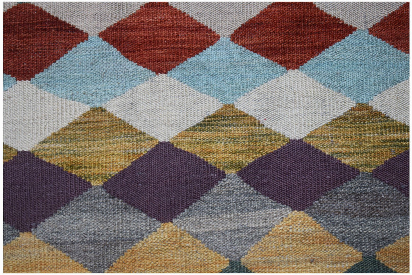 Handwoven Afghan Maimana kilim featuring a colorful geometric diamond pattern in wool.