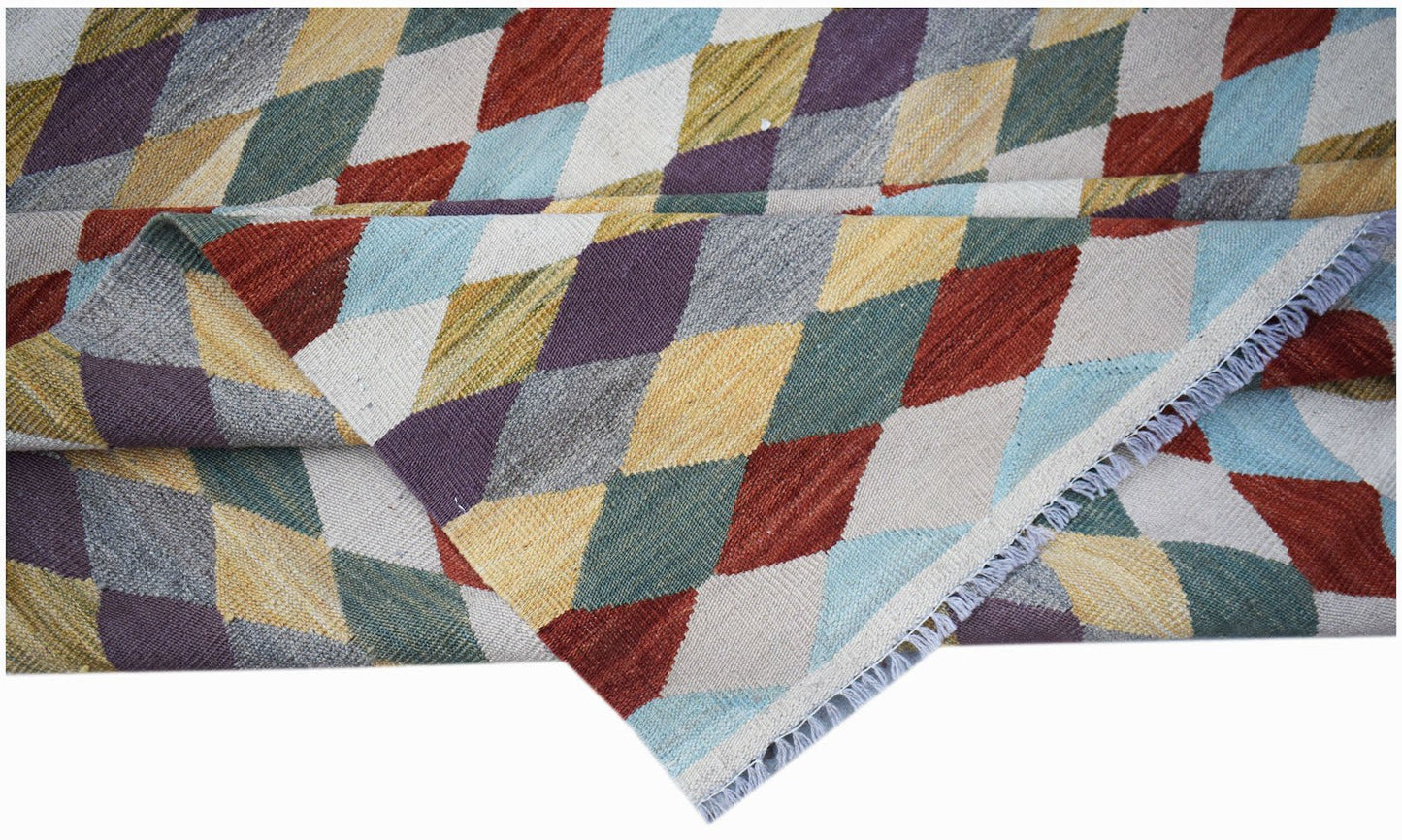 Handwoven Afghan Maimana kilim rug featuring a colorful geometric diamond pattern in wool.
