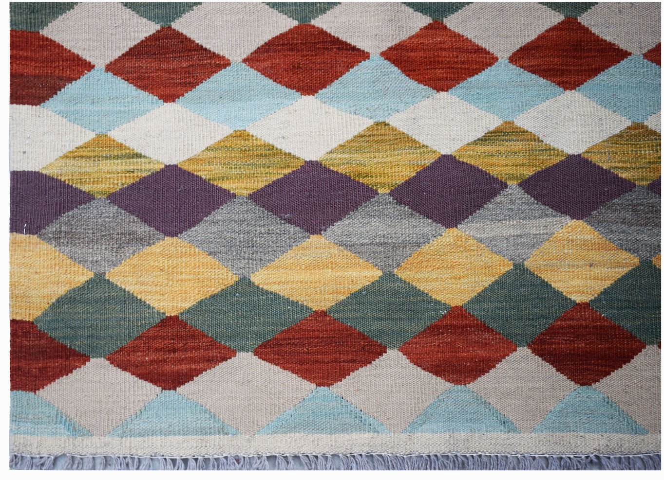 Handwoven Afghan Maimana kilim rug featuring a colorful geometric diamond pattern in wool.