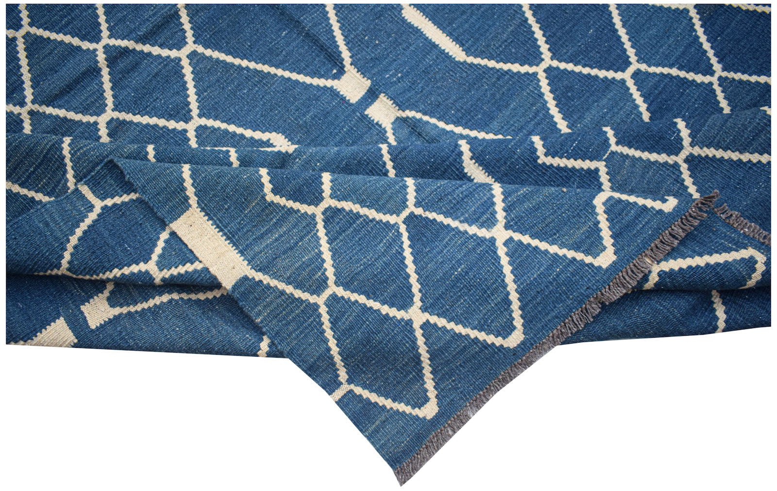 A handmade Afghan Maimana kilim rug featuring a blue field with a cream geometric diamond pattern.