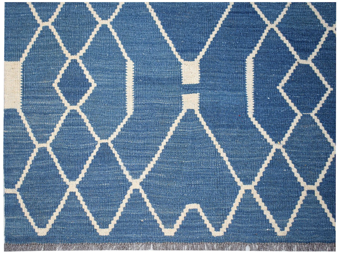 Afghan Maimana Kilim with a blue and white geometric diamond pattern.