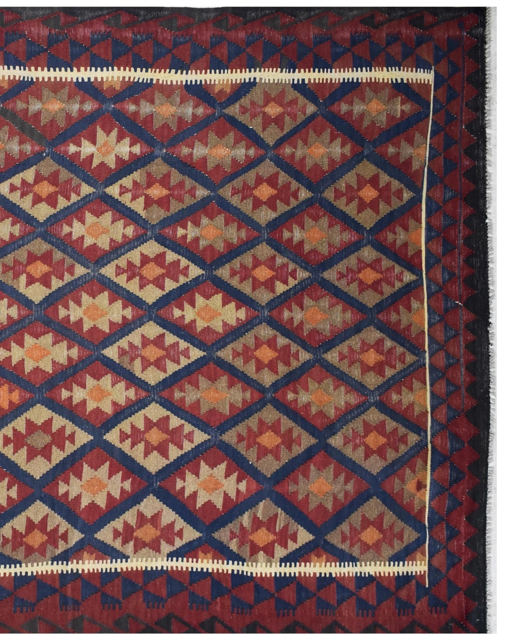 Handmade Afghan Maimana kilim rug featuring a repeating geometric diamond pattern in warm tones.