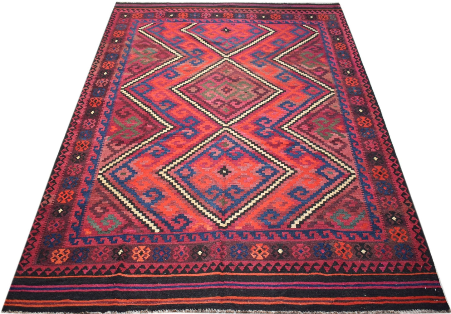 Handwoven Afghan Maimana kilim rug featuring a geometric diamond pattern in red and blue wool.