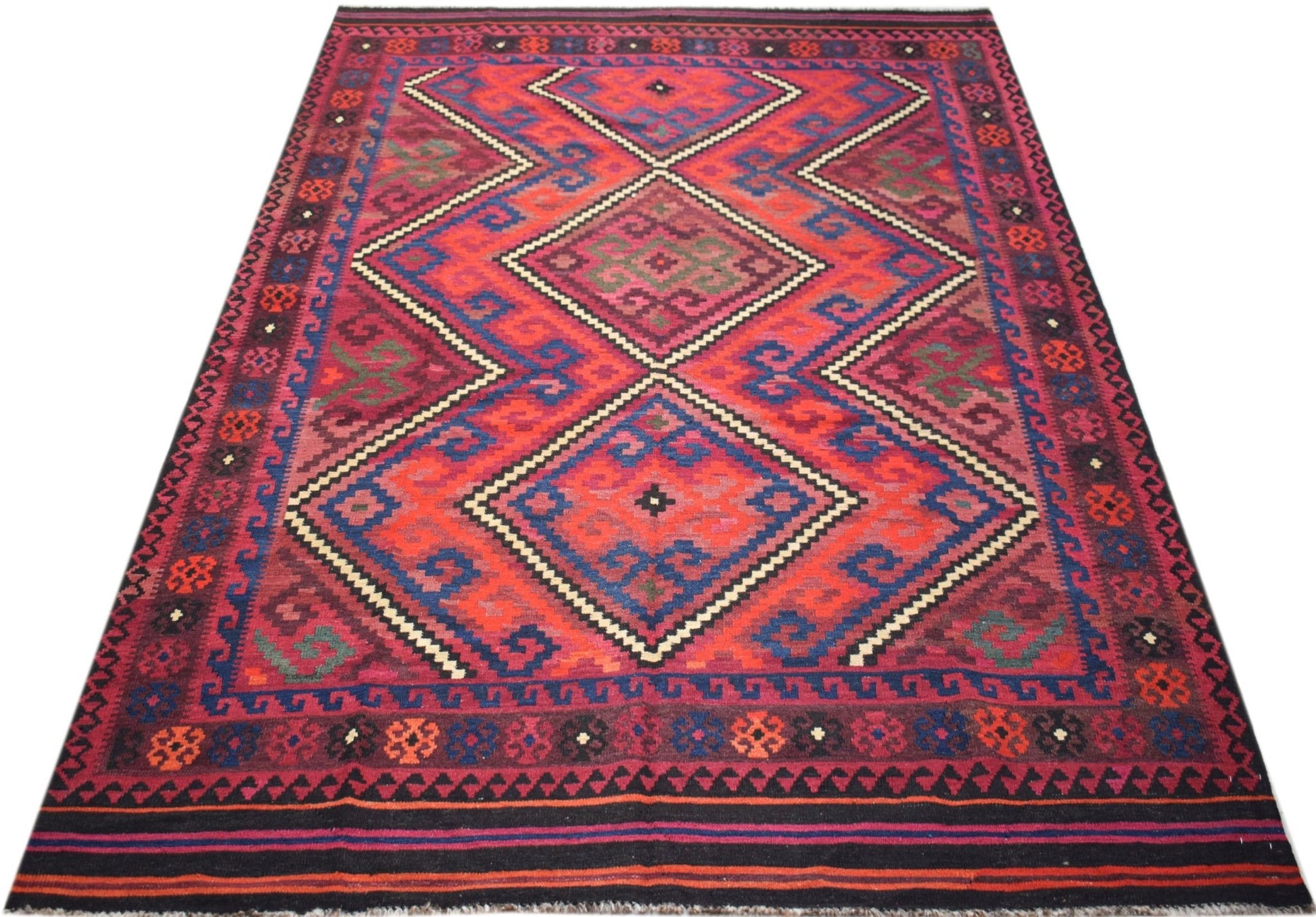 Handwoven Afghan Maimana kilim rug featuring a geometric diamond pattern in red and blue wool.