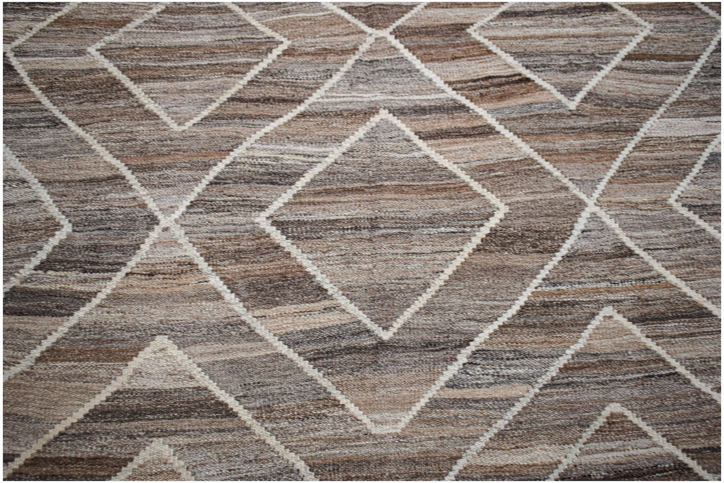 Handwoven Afghan Maimana wool kilim featuring a brown and beige geometric diamond pattern.