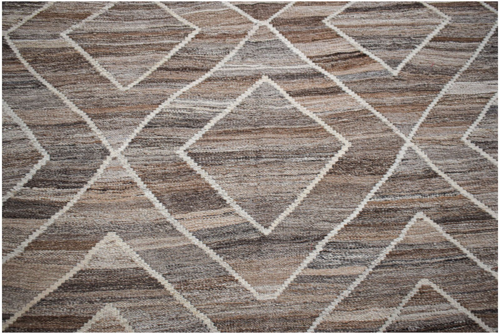 Handwoven Afghan Maimana wool kilim featuring a brown and beige geometric diamond pattern.