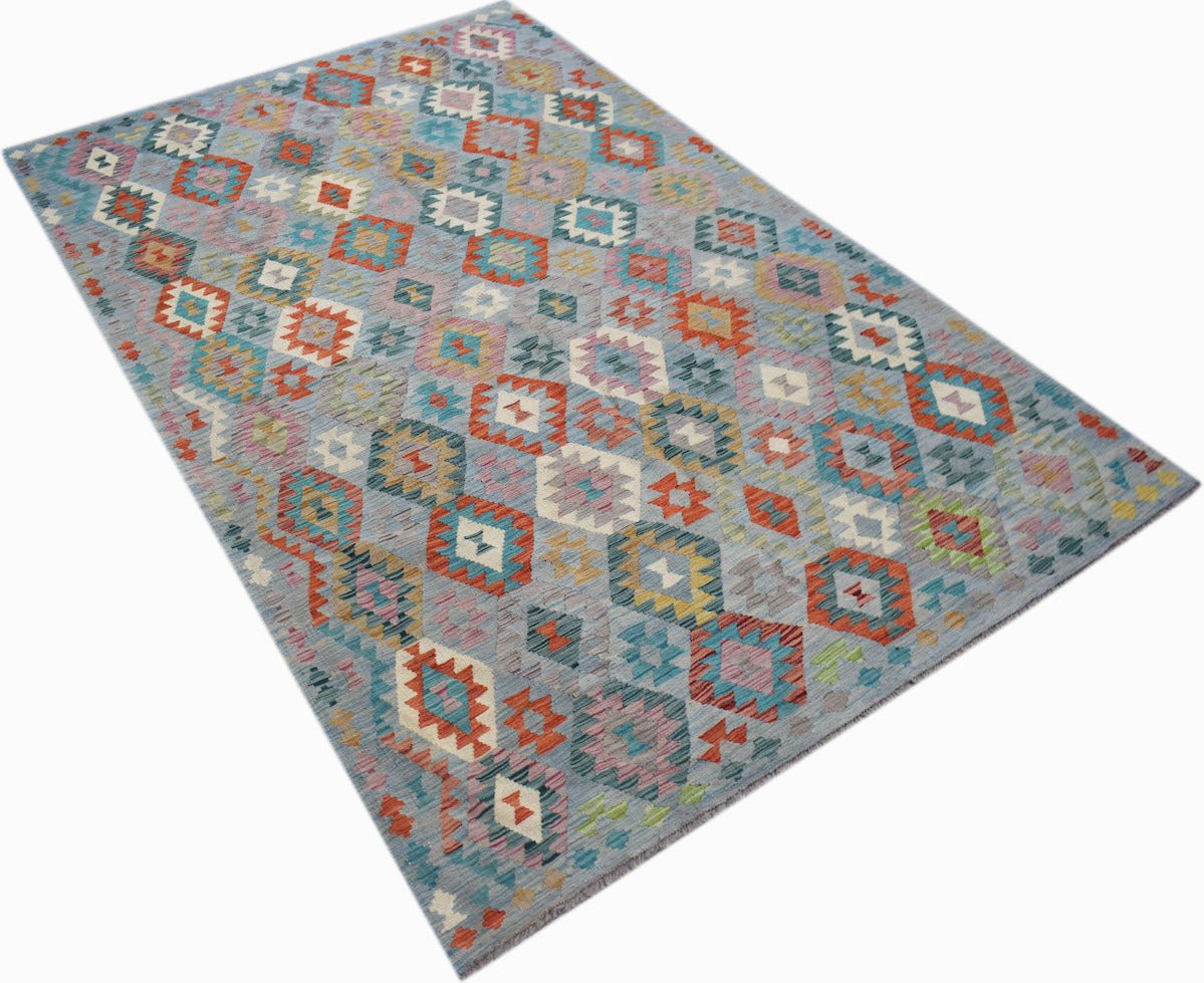 Handwoven Afghan Maimana kilim rug featuring a colorful geometric diamond pattern on a blue base.