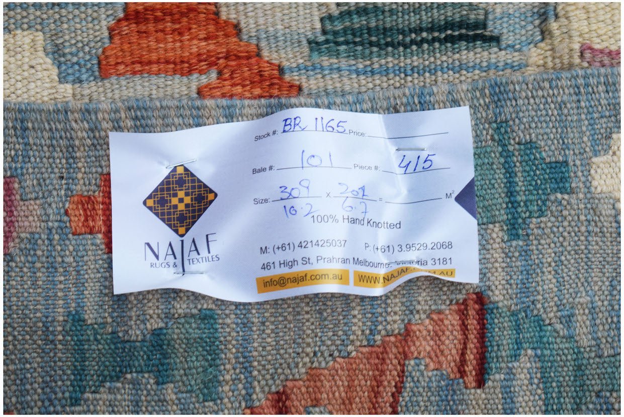 A handwoven Afghan Maimana kilim featuring a geometric pattern in blue, orange, and cream wool.