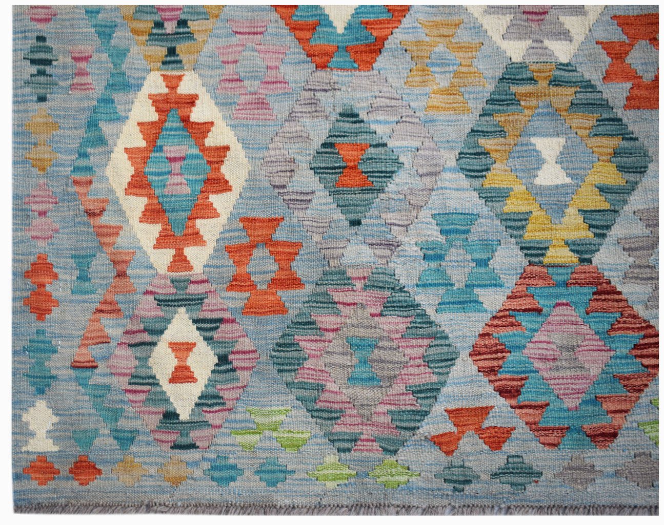 Handwoven Afghan Maimana kilim rug featuring a geometric diamond pattern in vibrant colors.