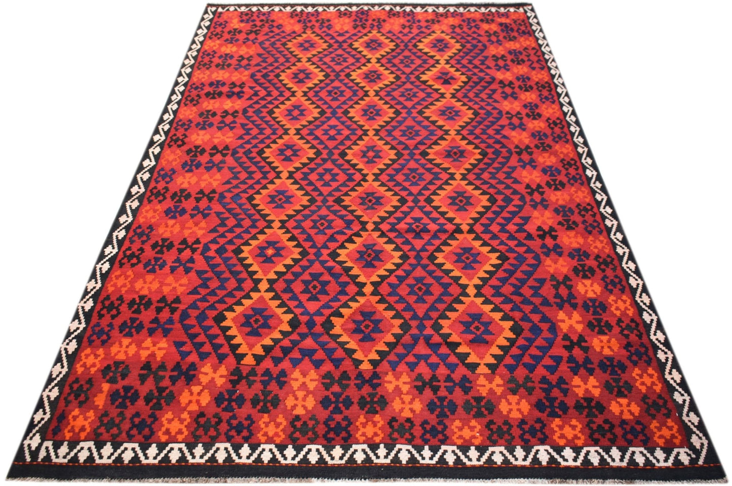 Handwoven Afghan Maimana kilim rug featuring a geometric diamond pattern in red, blue, and orange.