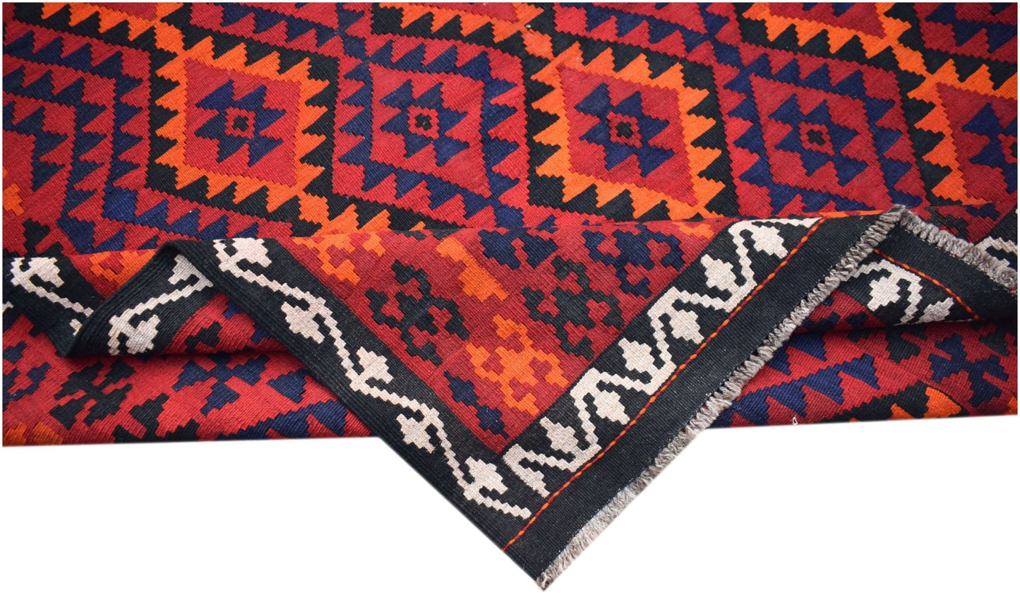 Handwoven Afghan Maimana kilim featuring a geometric pattern in red, orange, blue, and black.