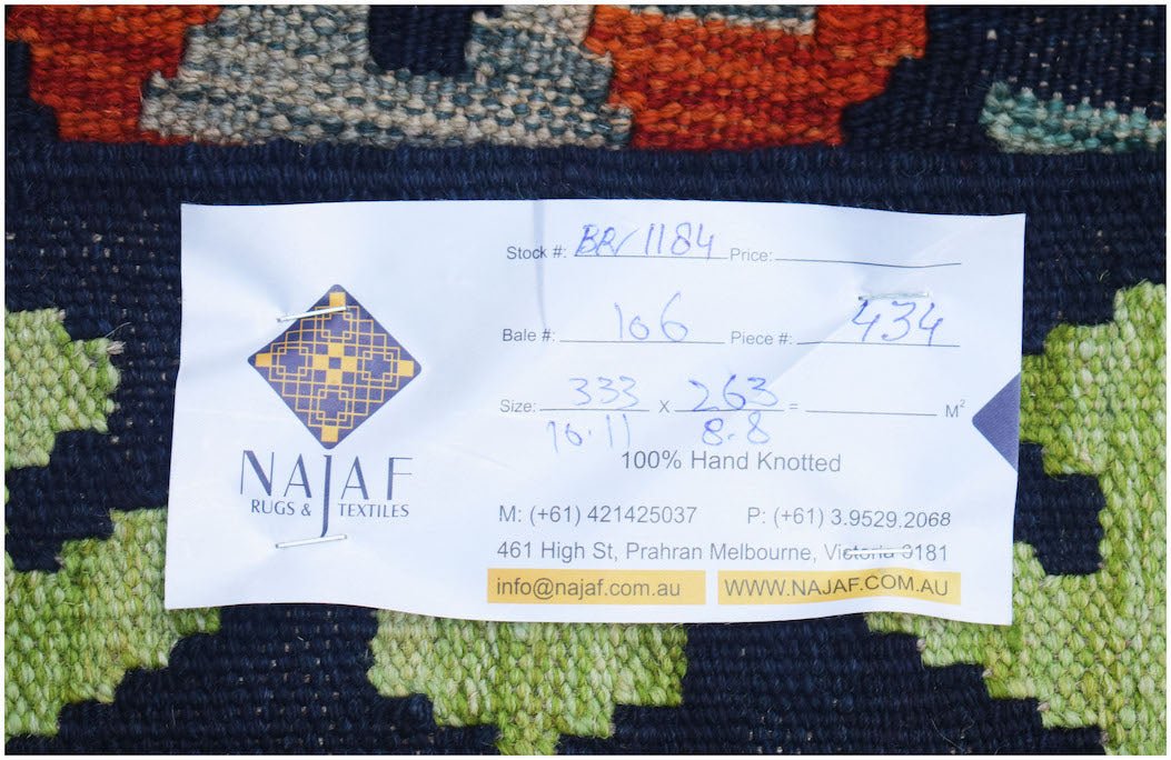 Handwoven Afghan Maimana kilim featuring a geometric pattern in vibrant colors.