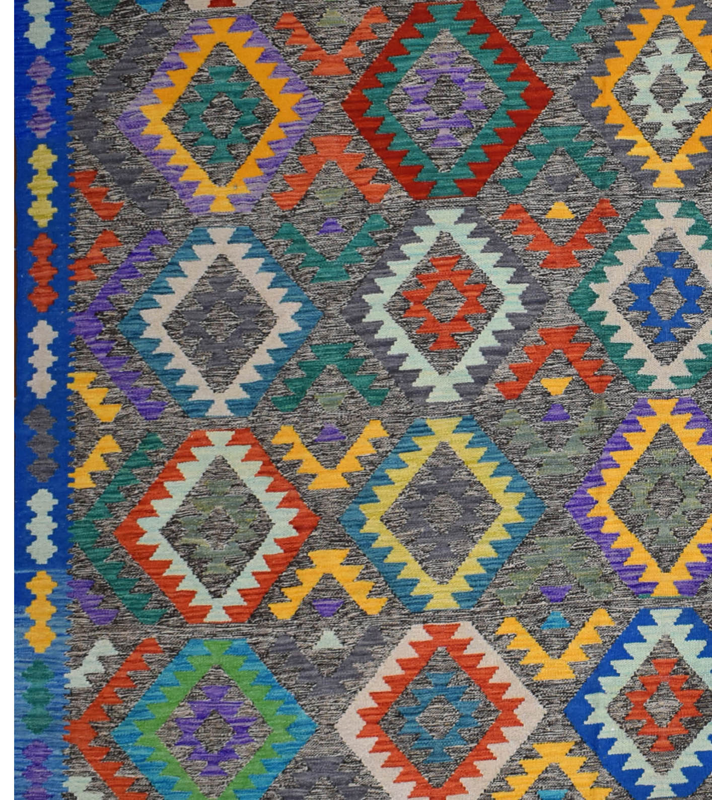 Handmade Afghan Maimana kilim rug featuring a vibrant geometric diamond pattern in wool.