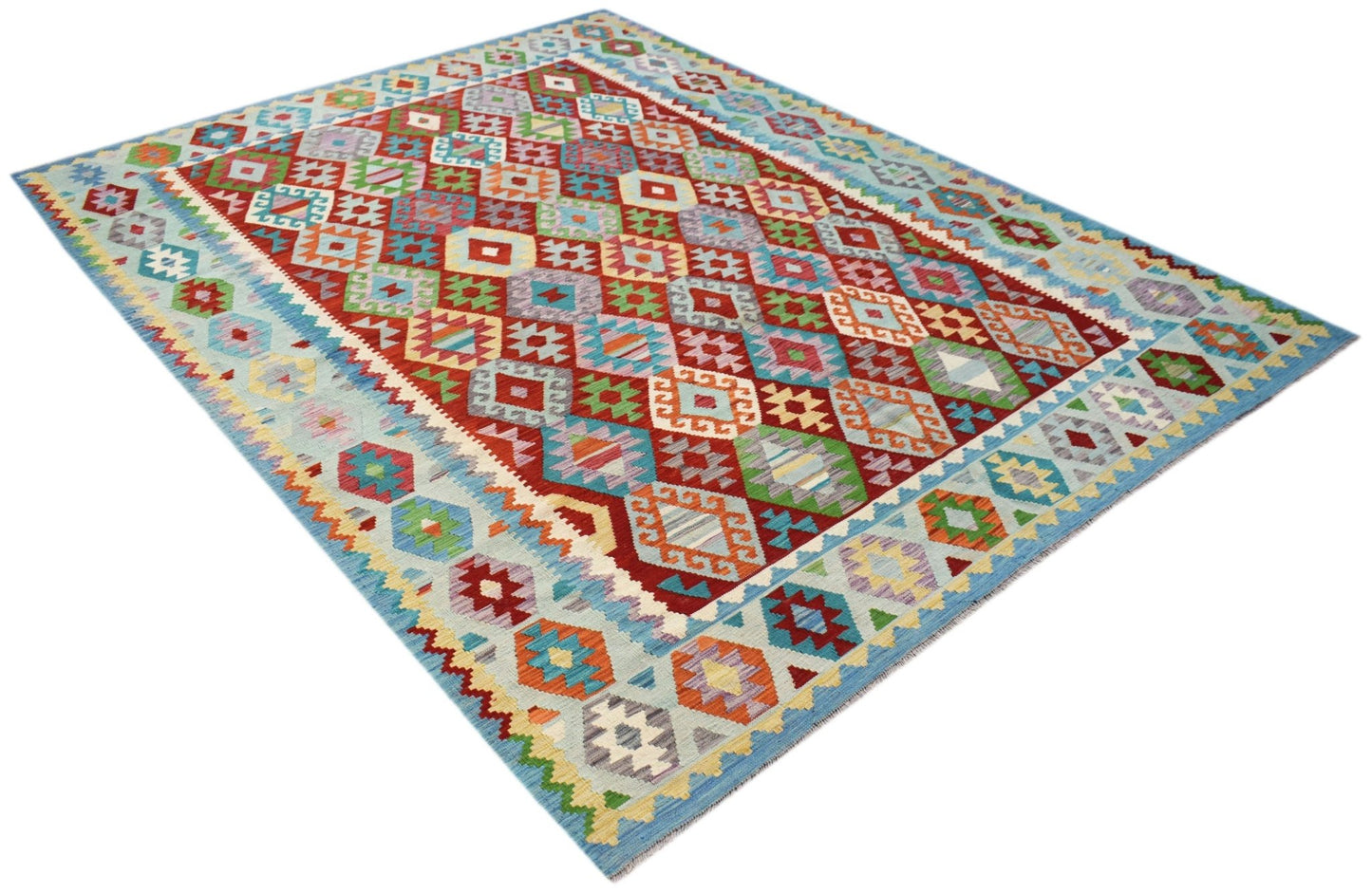 Handwoven Afghan Maimana kilim rug featuring a vibrant geometric diamond pattern in wool.