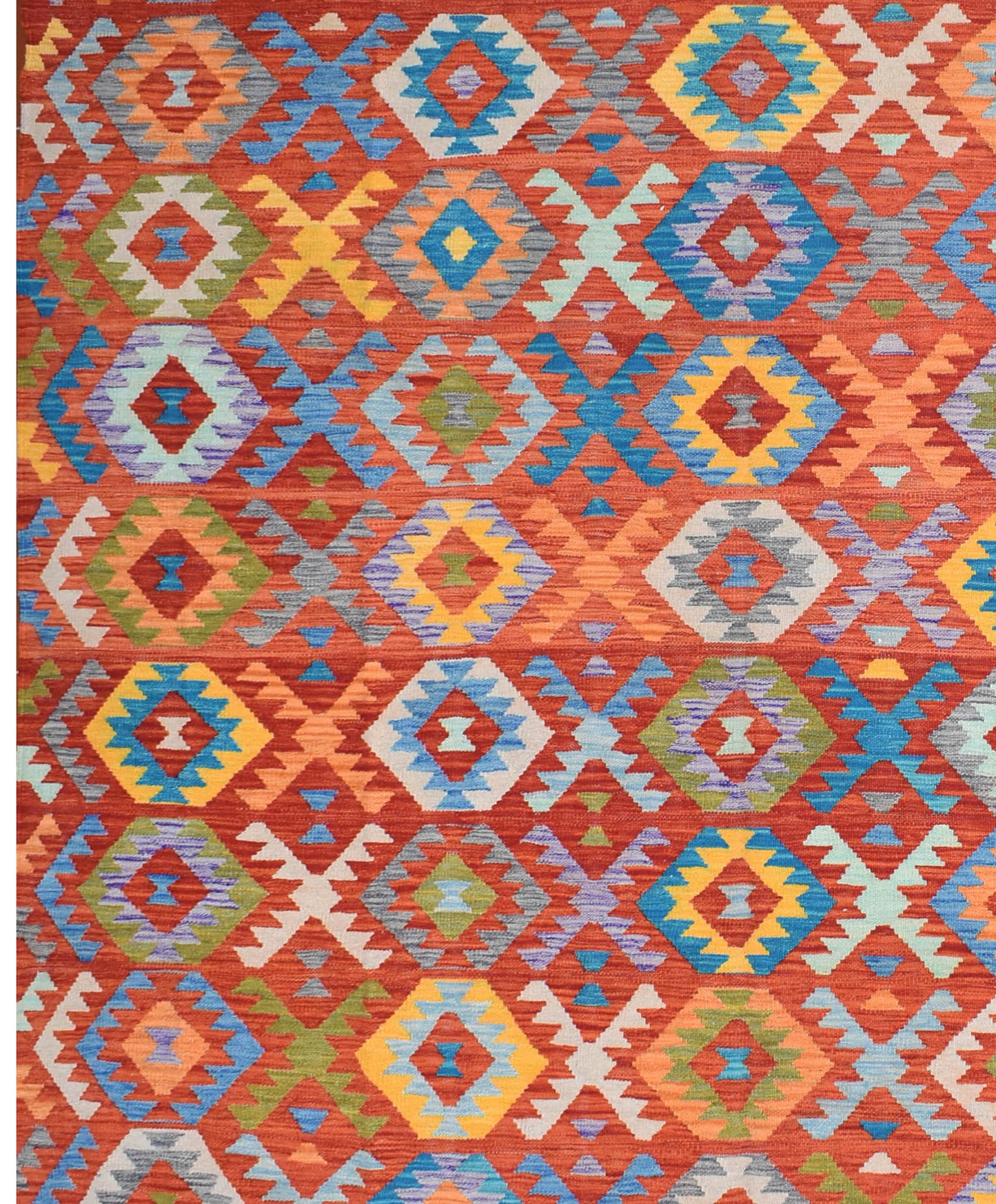 Handmade Afghan Maimana kilim rug featuring a vibrant geometric pattern in rich, warm colors.